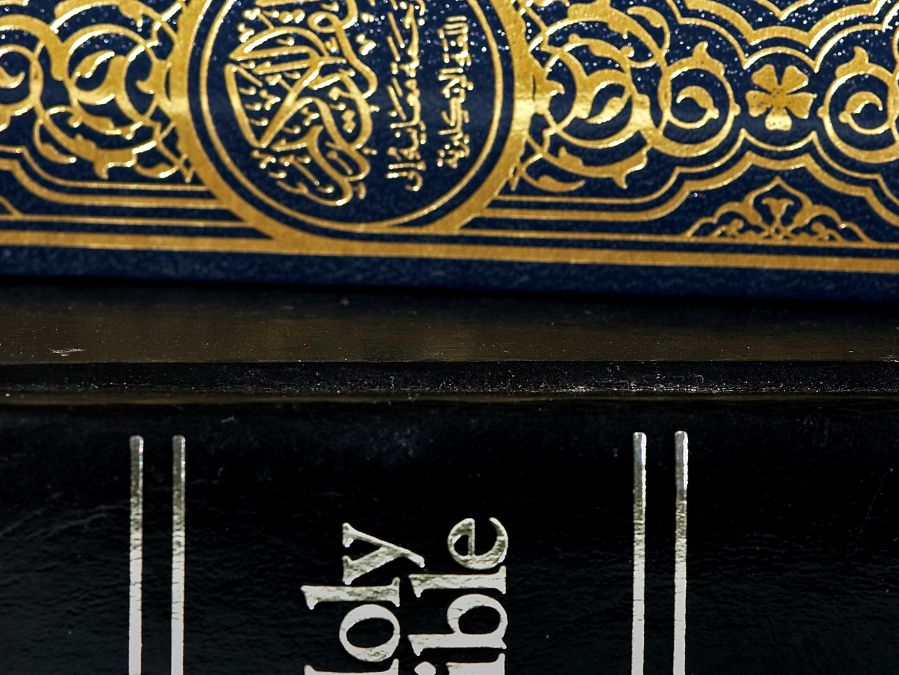 Close-up of Bible and Quran